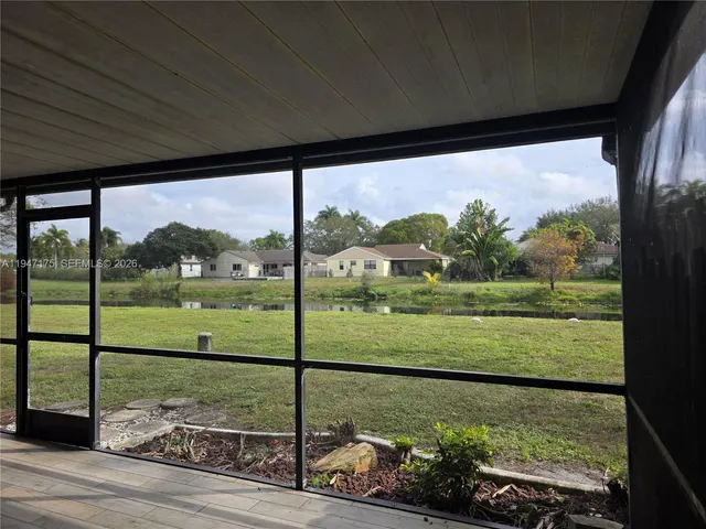 a view of a back yard from a balcony