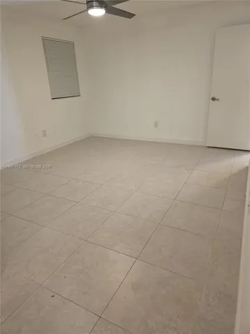 an empty room with a bathroom