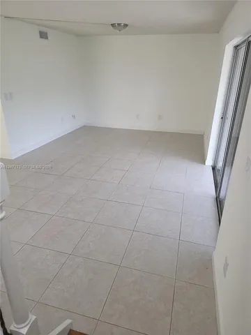 a view of a room with an empty space