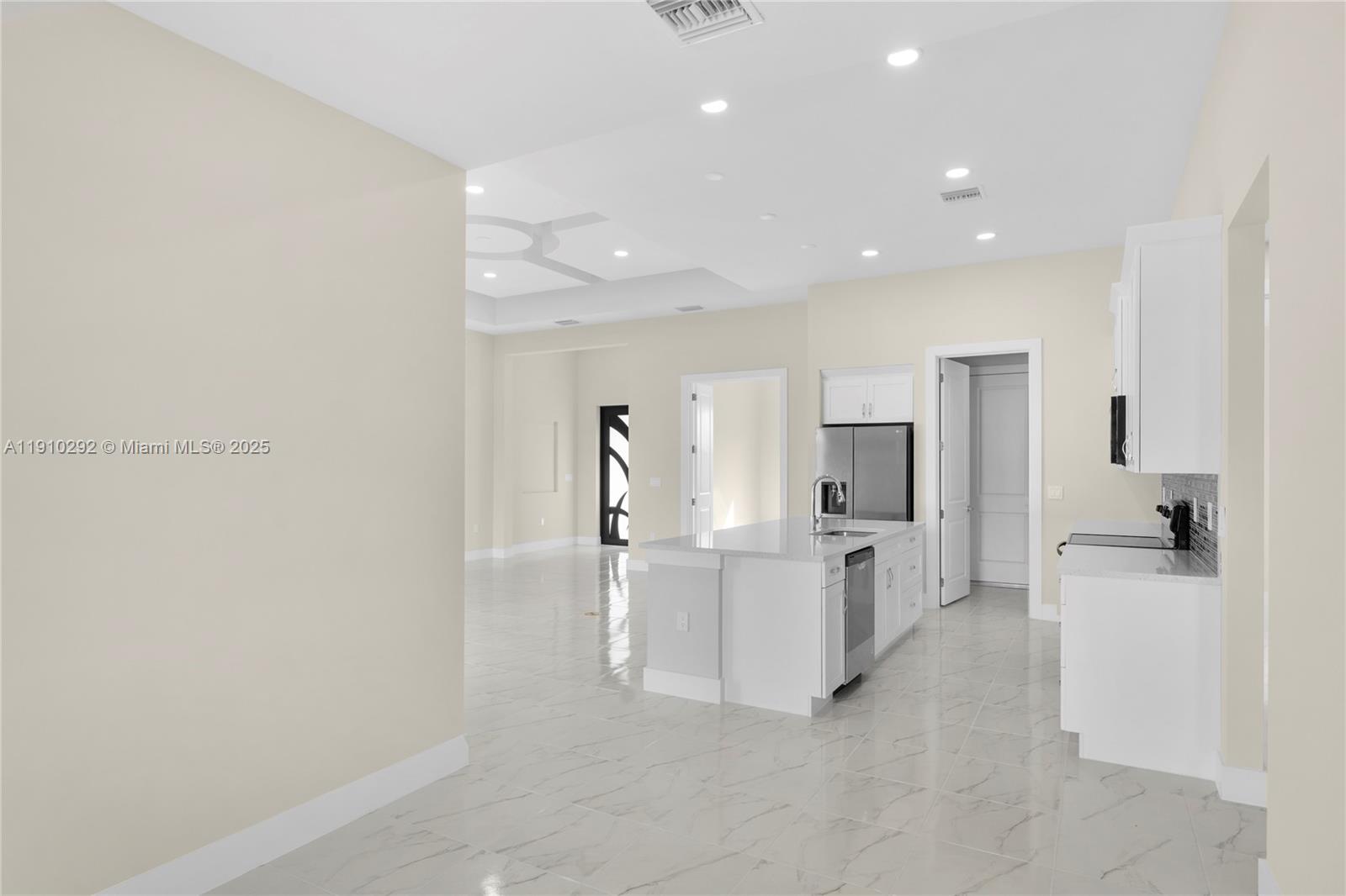 4100 8th Street Southwest Lehigh Acres, FL 33976 - Photo 11 of 24 a view of a kitchen with refrigerator and windows