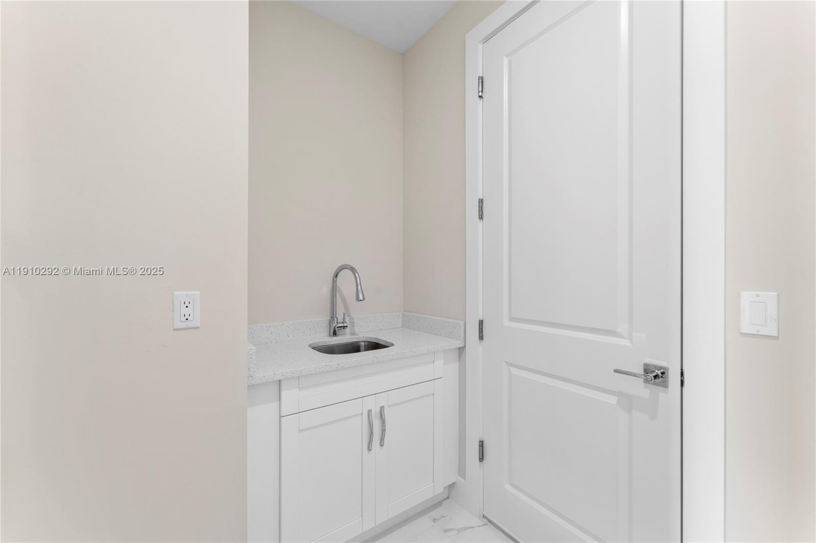 4100 8th Street Southwest Lehigh Acres, FL 33976 - Photo 21 of 24 a bathroom with a sink and vanity