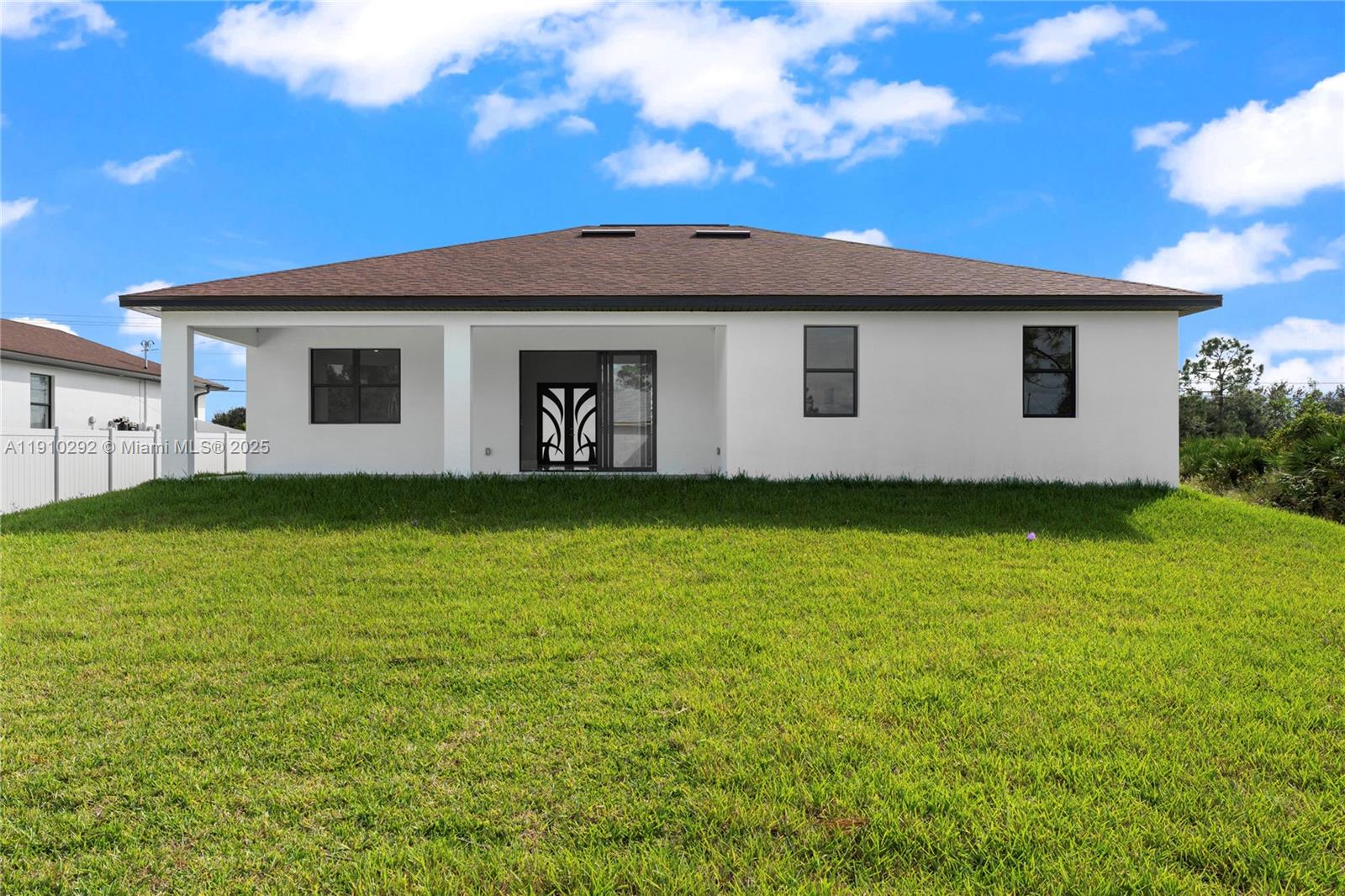 4100 8th Street Southwest Lehigh Acres, FL 33976 - Photo 24 of 24 a view of a house with a garden