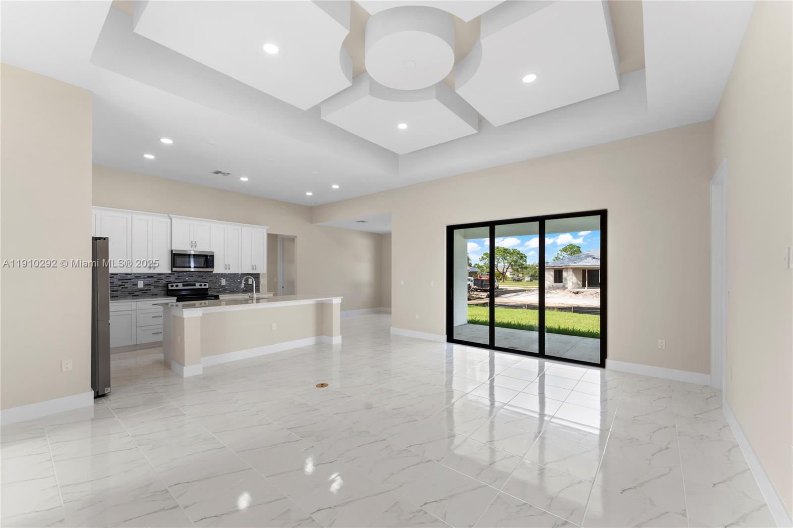 4100 8th Street Southwest Lehigh Acres, FL 33976 - Photo 3 of 24 a view of a kitchen with kitchen island and a window