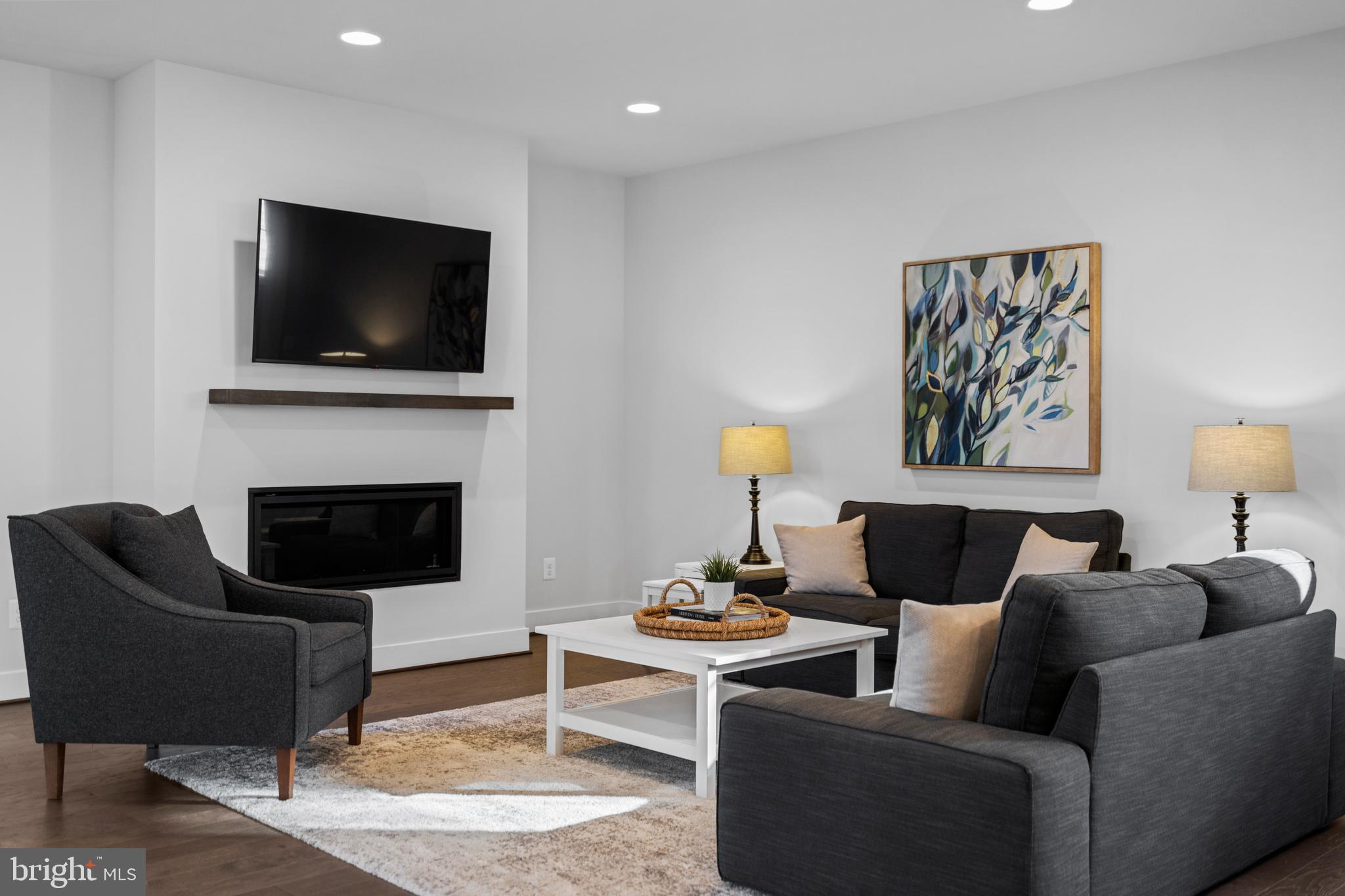 42064 Creighton Road Brambleton, VA 20148 - Photo 16 of 56 A Living Room That Exudes Warmth