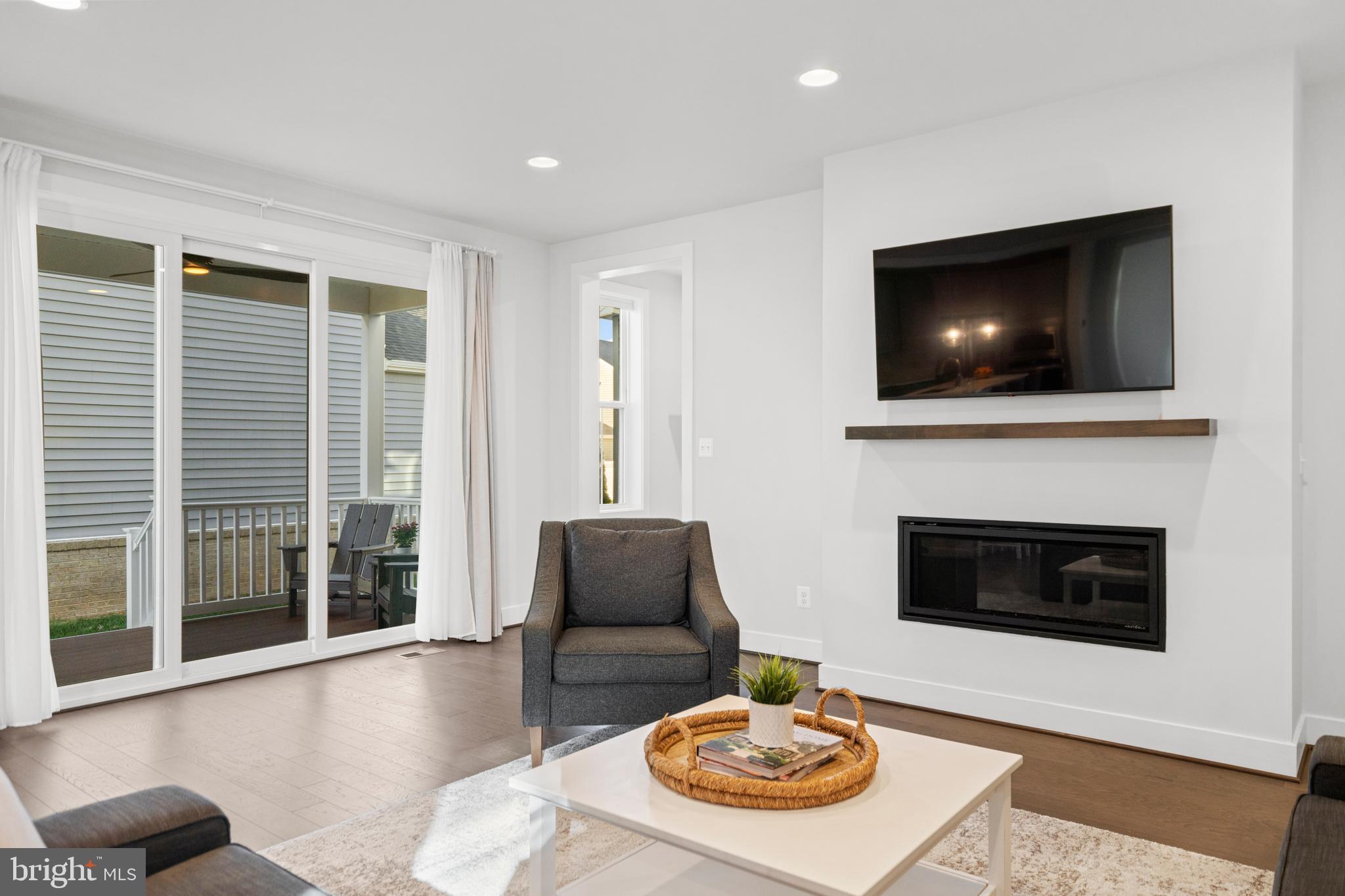 42064 Creighton Road Brambleton, VA 20148 - Photo 17 of 56 Access the Deck from the Living Room