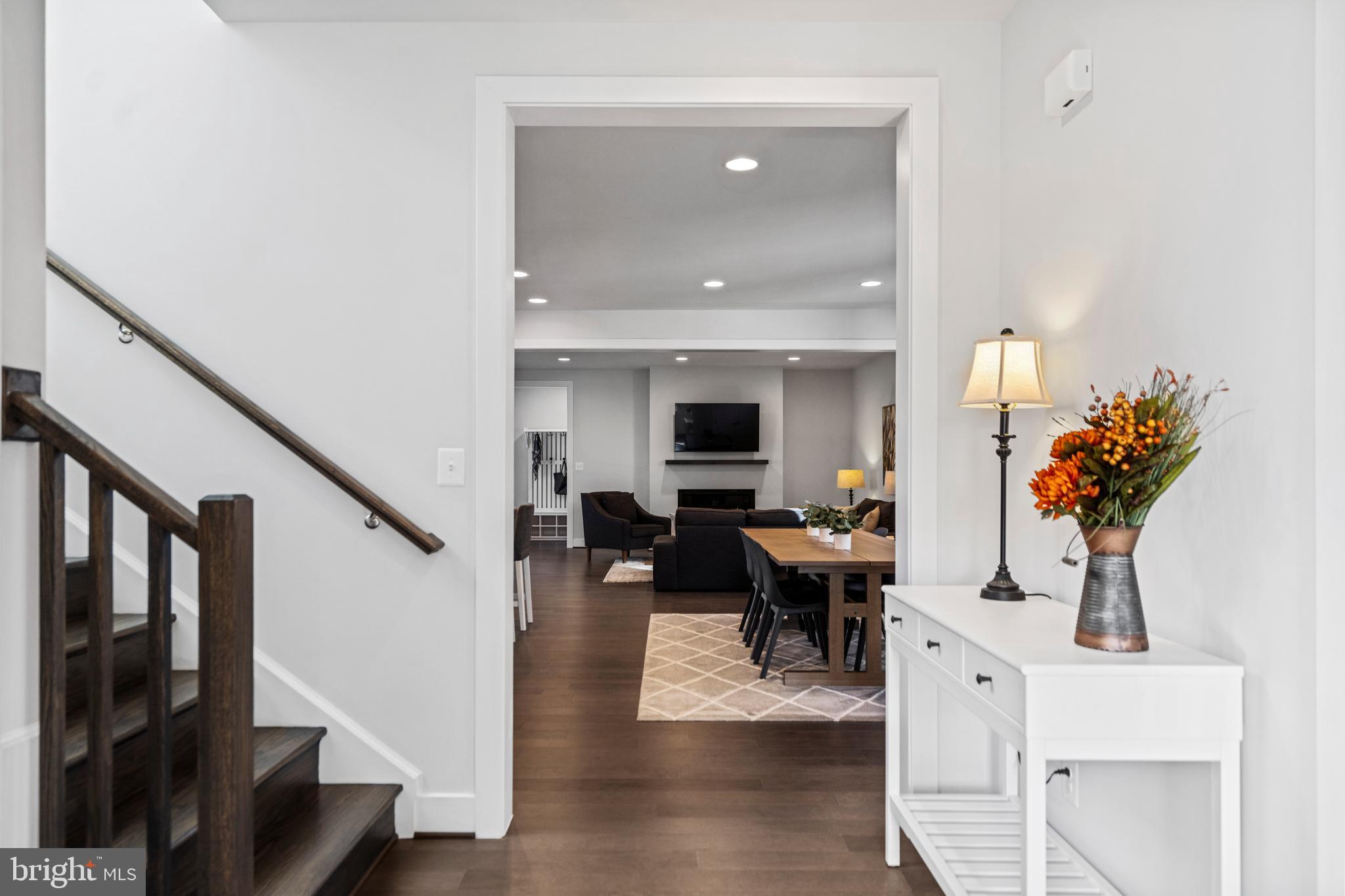 42064 Creighton Road Brambleton, VA 20148 - Photo 6 of 56 Foyer Flows into the Kitchen and Living Room