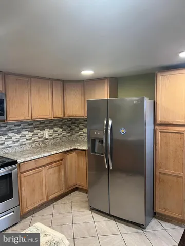 a view of a hallway with brick walls