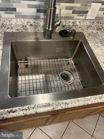 a view of kitchen with cabinets and wooden floor