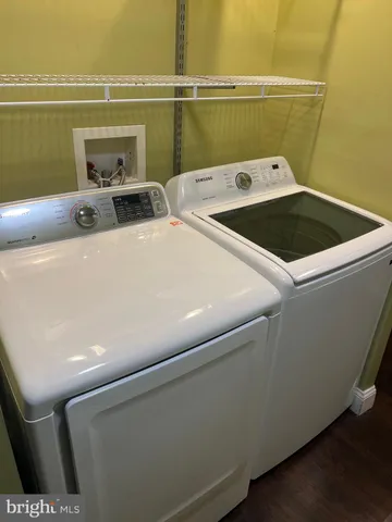 a view of hallway with wooden floor