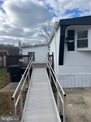 a view of a car park in front of house