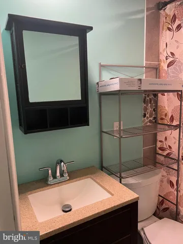 a bedroom with a bed and furniture