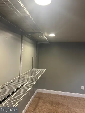 a room with a closet and wooden floor