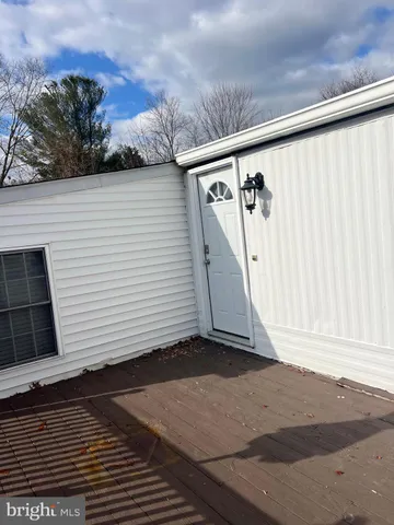 a view of entryway wooden floor and front door
