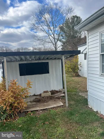 a view of roof deck with furniture and wooden floor