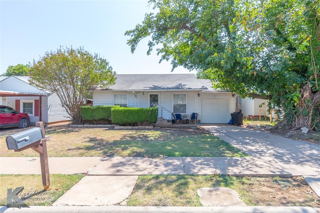 1649 South 16th Street Abilene, TX 79602 - Photo 1 of 24 a view of a house with backyard and tree