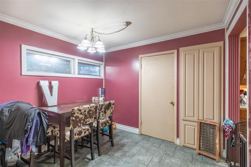 1649 South 16th Street Abilene, TX 79602 - Photo 12 of 24 a view of a dining room with furniture and chandelier