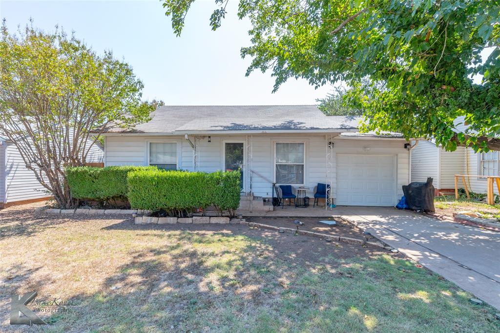 1649 South 16th Street Abilene, TX 79602 - Photo 2 of 24 a view of a house with backyard and trees