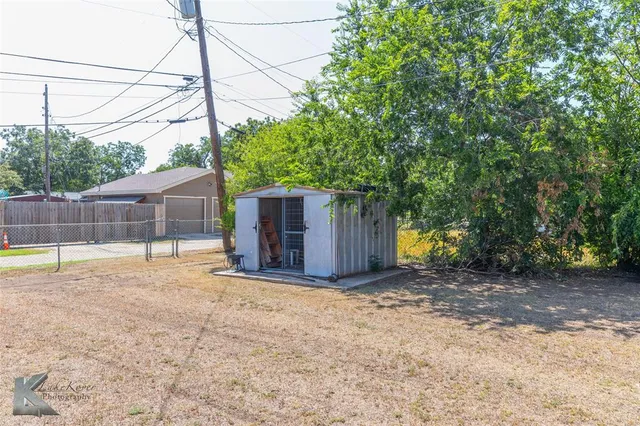 a view of a backyard of the house