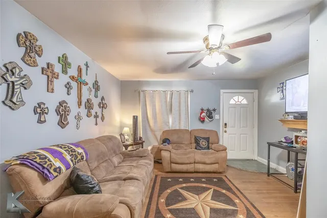 a living room with furniture and a window