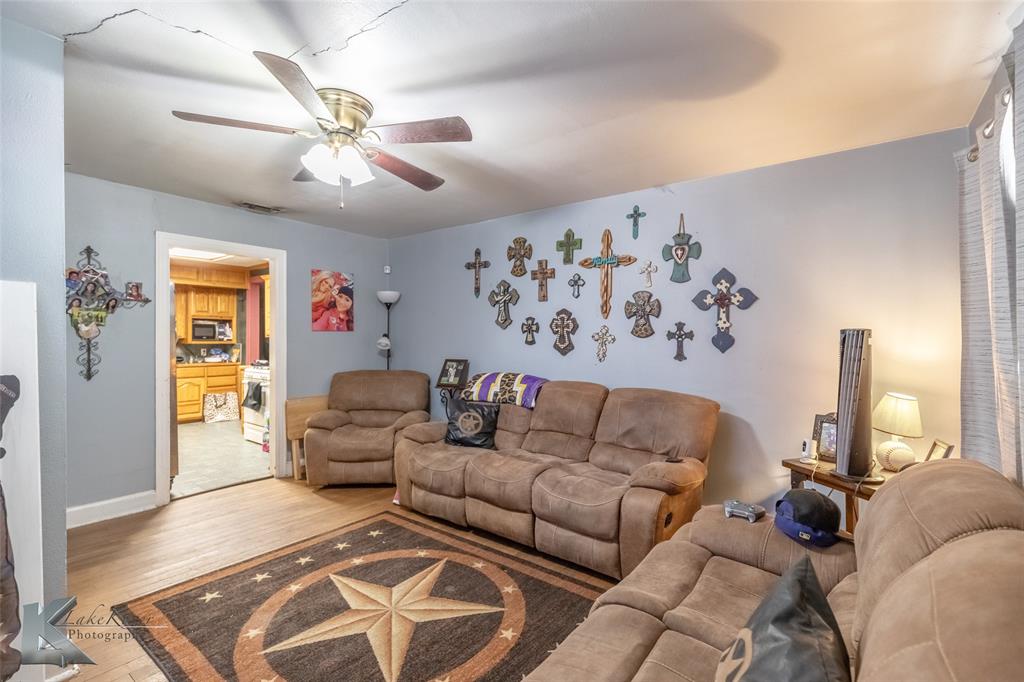 1649 South 16th Street Abilene, TX 79602 - Photo 5 of 24 a living room with furniture and a large window