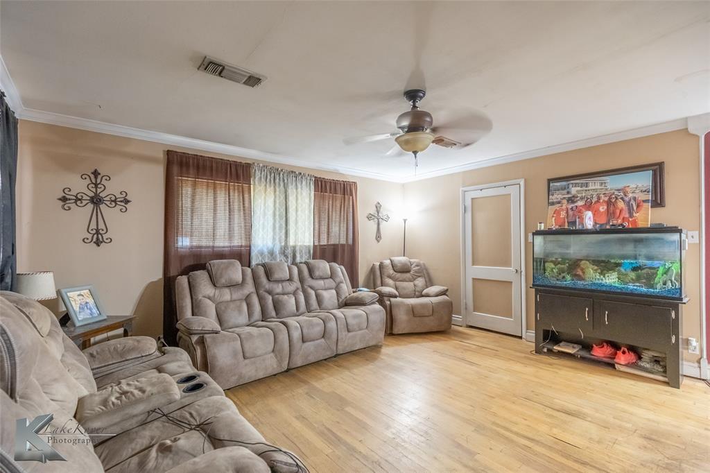 1649 South 16th Street Abilene, TX 79602 - Photo 9 of 24 a living room with furniture and a flat screen tv