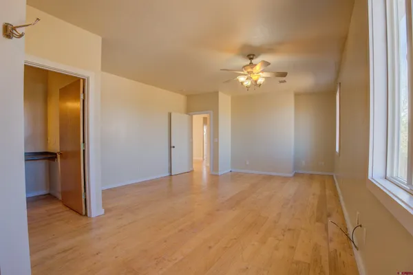 a view of a room with wooden floor