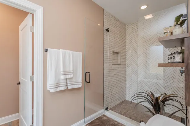 a bathroom with a toilet and a shower curtain
