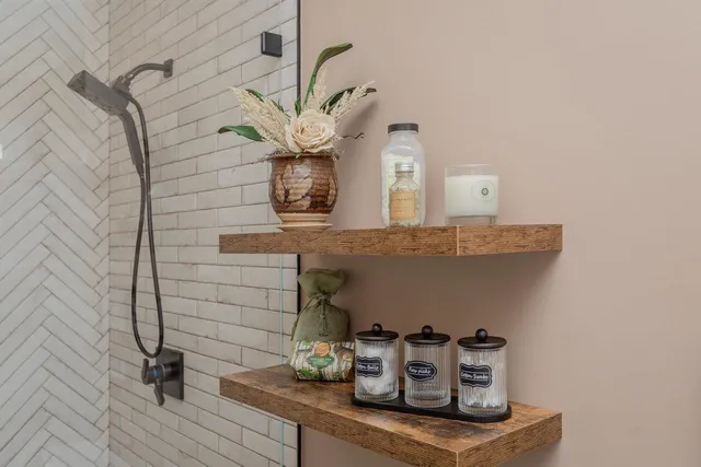 a bedroom with a bed and flat screen tv