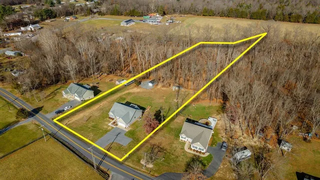 a kitchen with stainless steel appliances a stove refrigerator and microwave