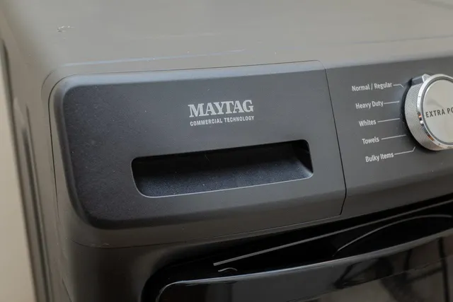 a view of a house with a swimming pool and a yard