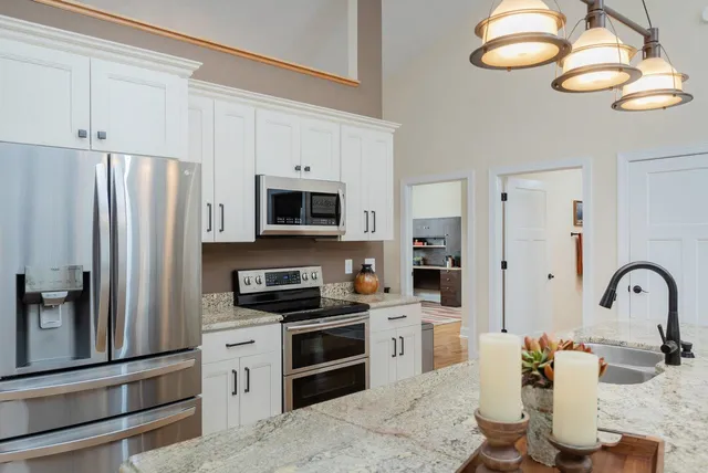 a view of a living room and kitchen