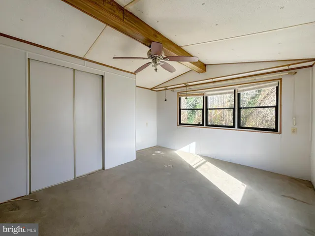 a view of empty room with windows