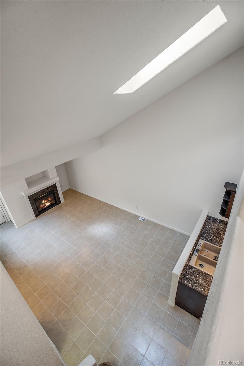 11690 West 46th Avenue Wheat Ridge, CO 80033 - Photo 13 of 33 a view of an empty room with kitchen