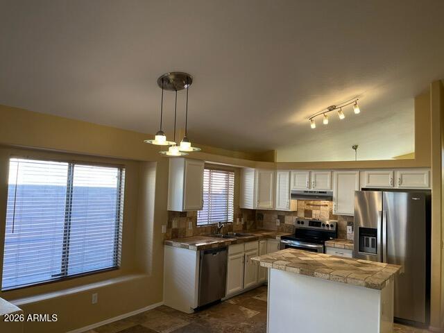 18630 North 28th Way Phoenix, AZ 85050 - Photo 18 of 18 a kitchen with stainless steel appliances granite countertop a sink stove and refrigerator