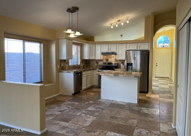 18630 North 28th Way Phoenix, AZ 85050 - Photo 6 of 18 a kitchen with granite countertop stainless steel appliances and a chandelier