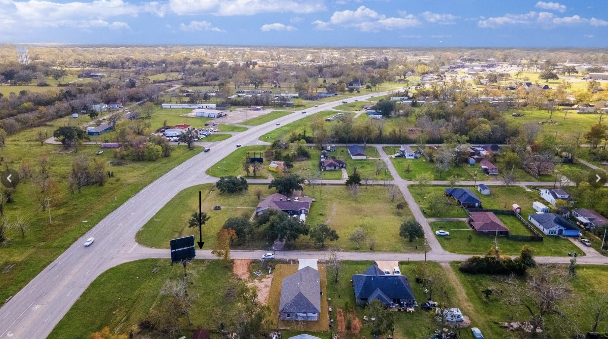 0 East Travis Street Brazoria, TX 77422 - Photo 3 of 5 an aerial view of residential houses with outdoor space