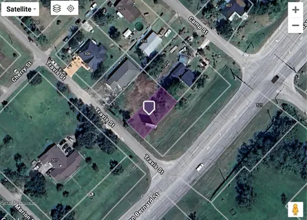 an aerial view of a residential building with an outdoor space