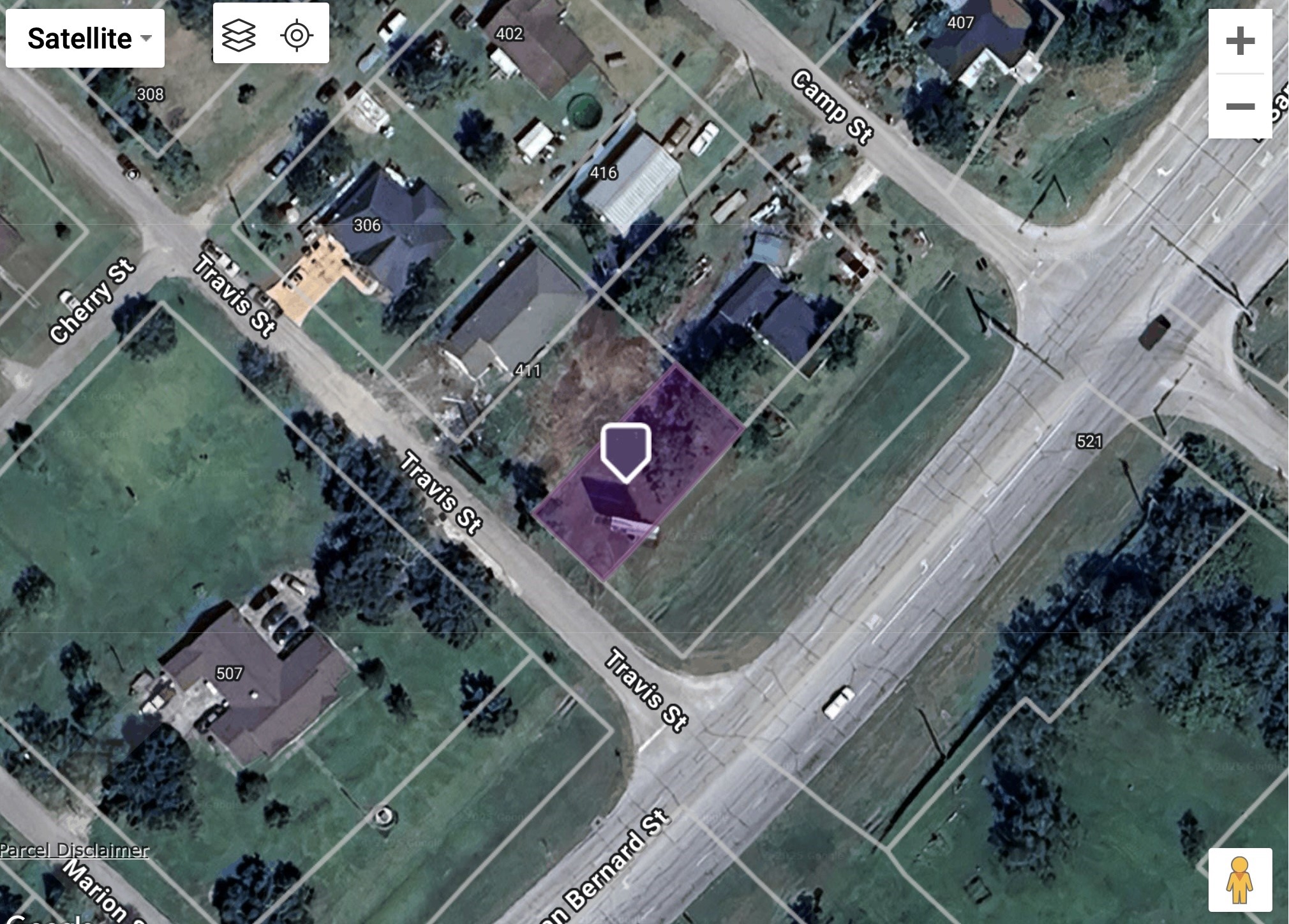 0 East Travis Street Brazoria, TX 77422 - Photo 4 of 5 an aerial view of a residential building with an outdoor space