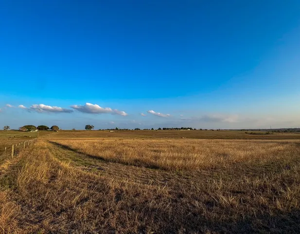 a view of an ocean beach and mountain