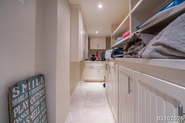 a kitchen with granite countertop a sink and cabinets