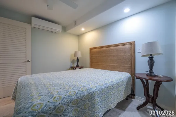 a bedroom with a bed and a table