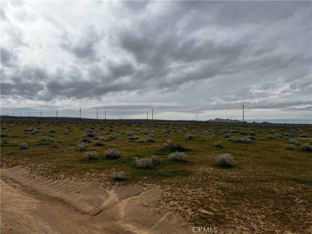 a view of a large body of water and mountain in back