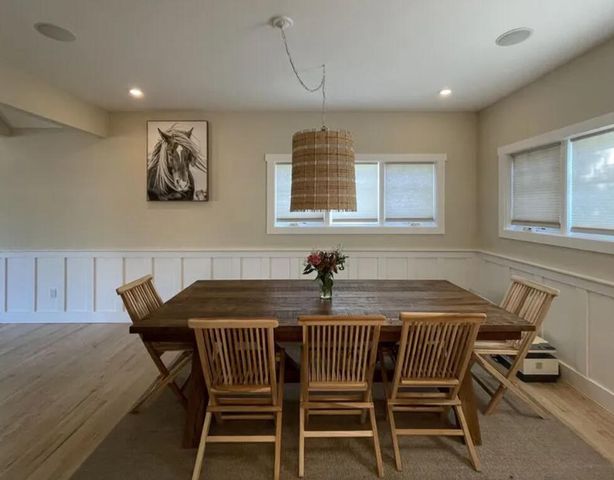 a view of a dining room with furniture and window