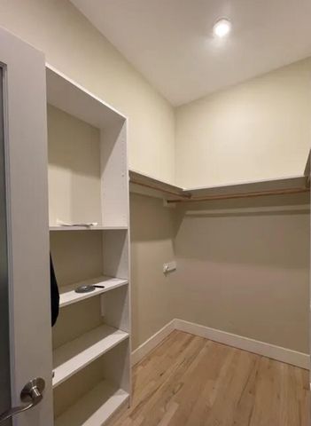 a view of an empty walk in closet