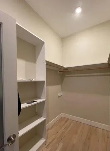 a view of an empty walk in closet