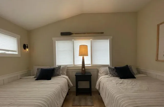 a bedroom with a bed and window