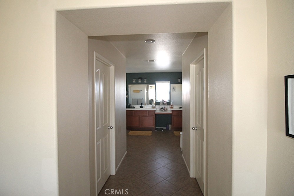 924 Condor Street Barstow, CA 92311 - Photo 34 of 52 a view of a hallway with a livingroom and a bathroom