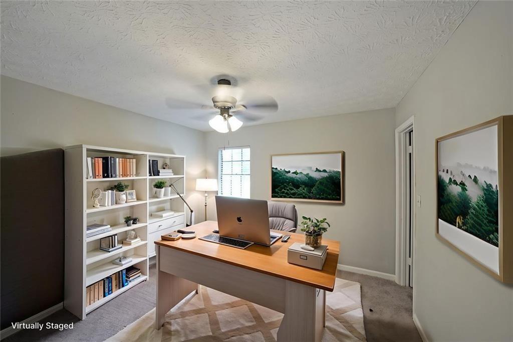 3087 Drexel Lane Rex, GA 30273 - Photo 15 of 22 a view of workspace with wooden floor and windows