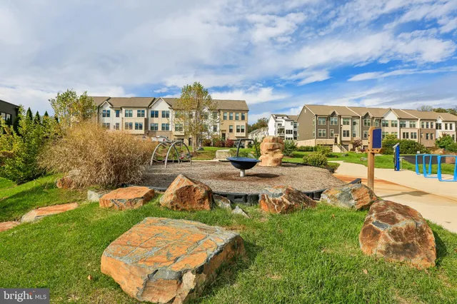 a view of a water fountain in front of the house