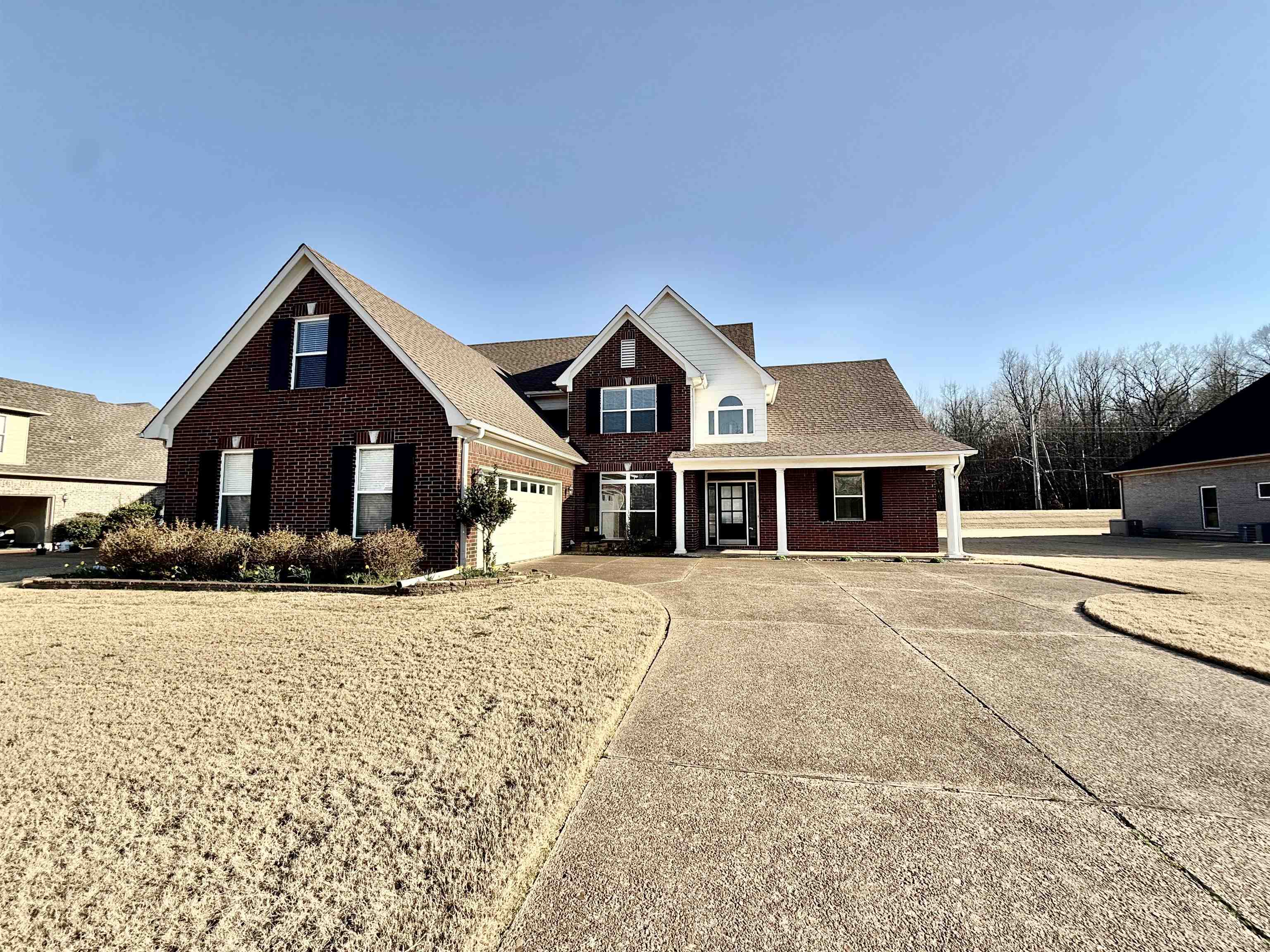4560 Model Cove Bartlett, TN 38002 - Photo 1 of 18 a front view of a house with a yard